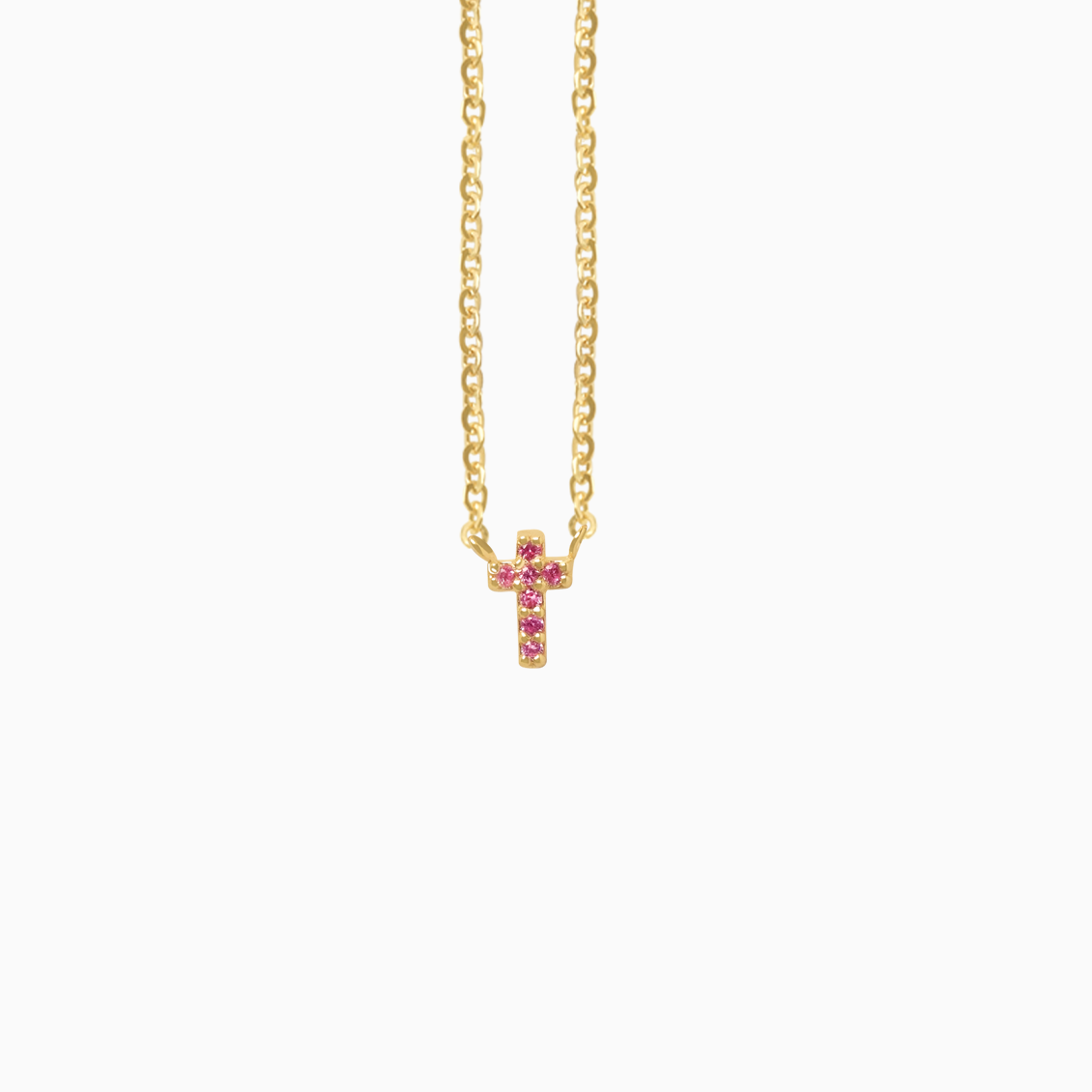 Collar en oro amarillo de 18K cruz con zafiros rosados