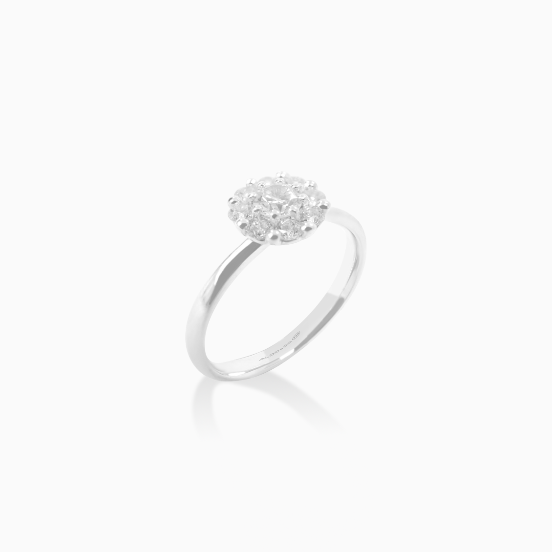 Anillo oro blanco 18K roseta con brillante