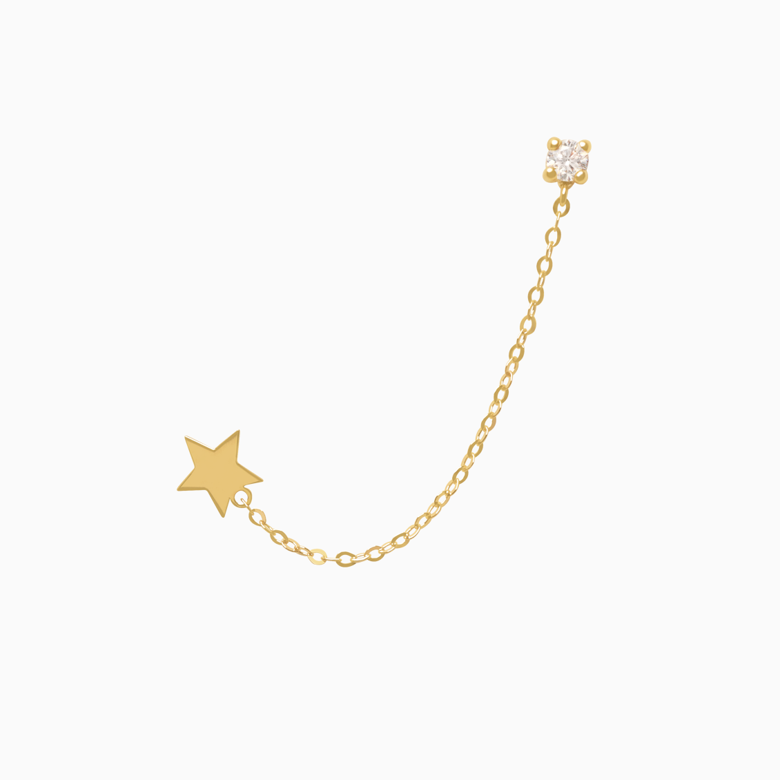 Medio arete en oro amarillo de 18K estrella con cadena colgante con brillante