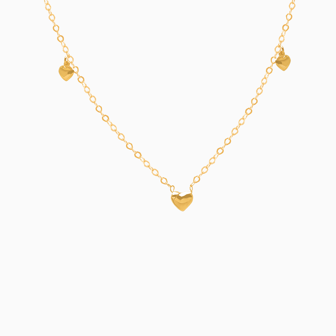 Collar en oro amarillo de 18K con 3 corazones colgantes bombeados