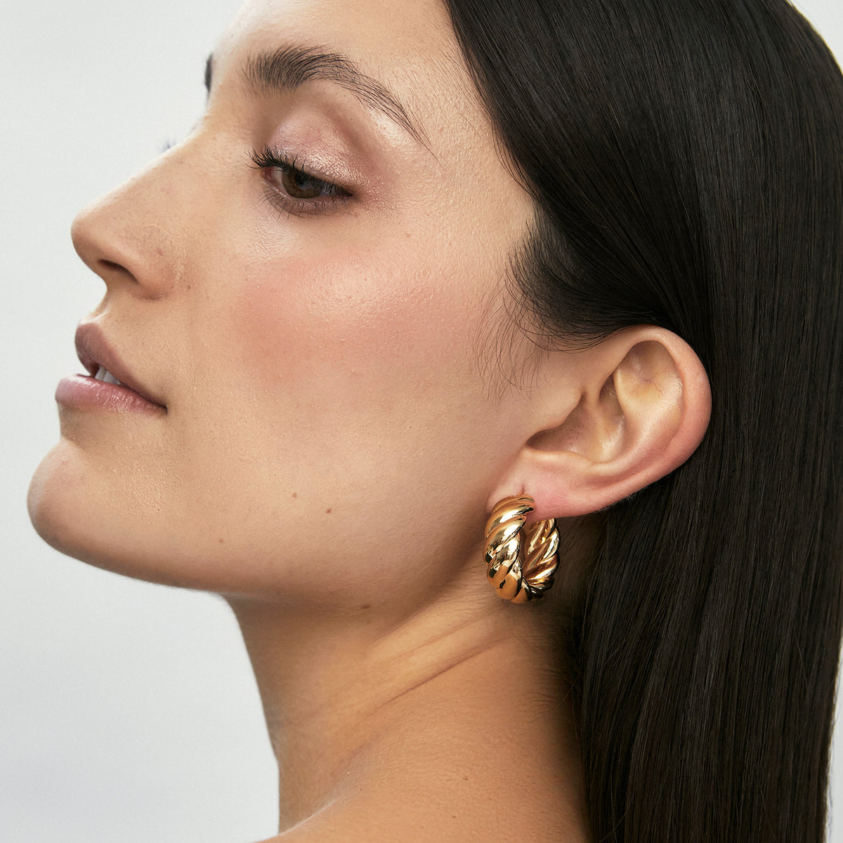 Aretes oro amarillo 18K argollas trenzadas