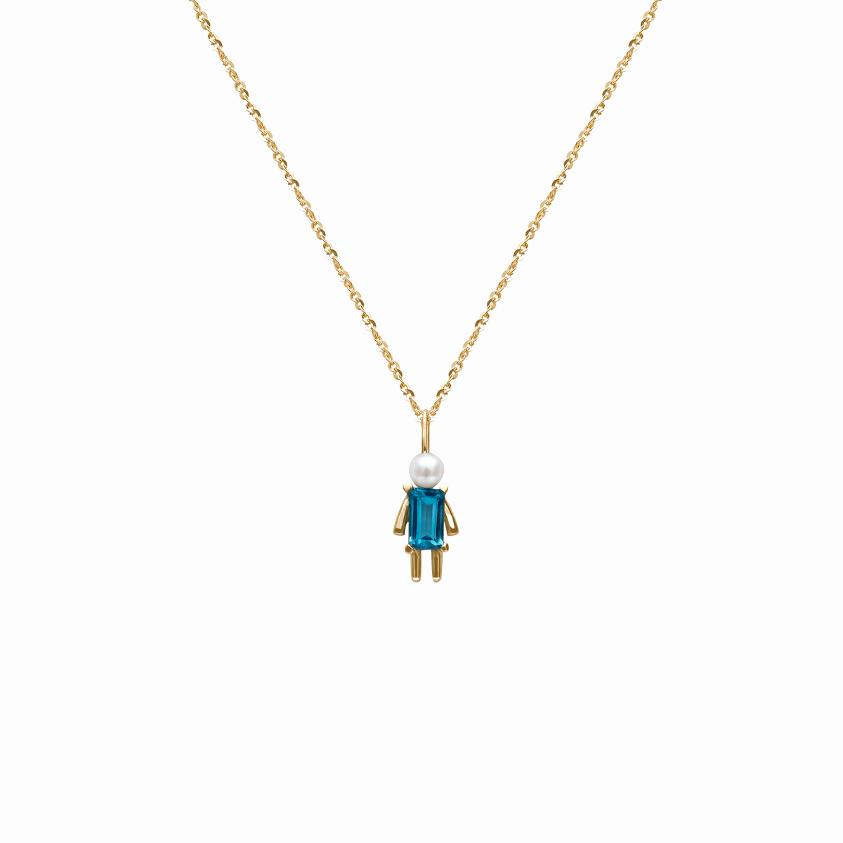 Dije en oro amarillo 18K con perla y topacio corte esmeralda
