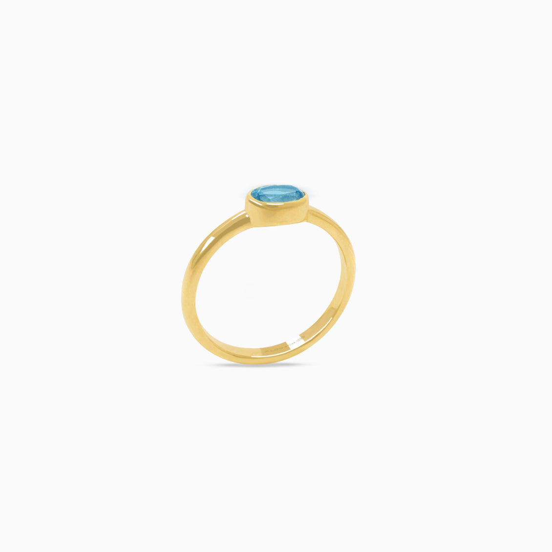 Anillo oro amarillo 18K topacio azul london blue oval