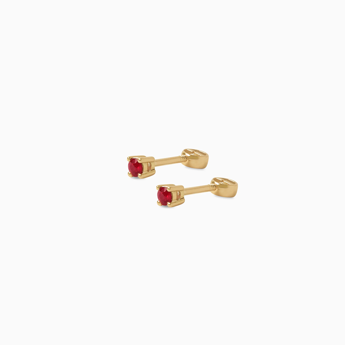 Aretes en oro amarillo de 18K punto de luz con rubí