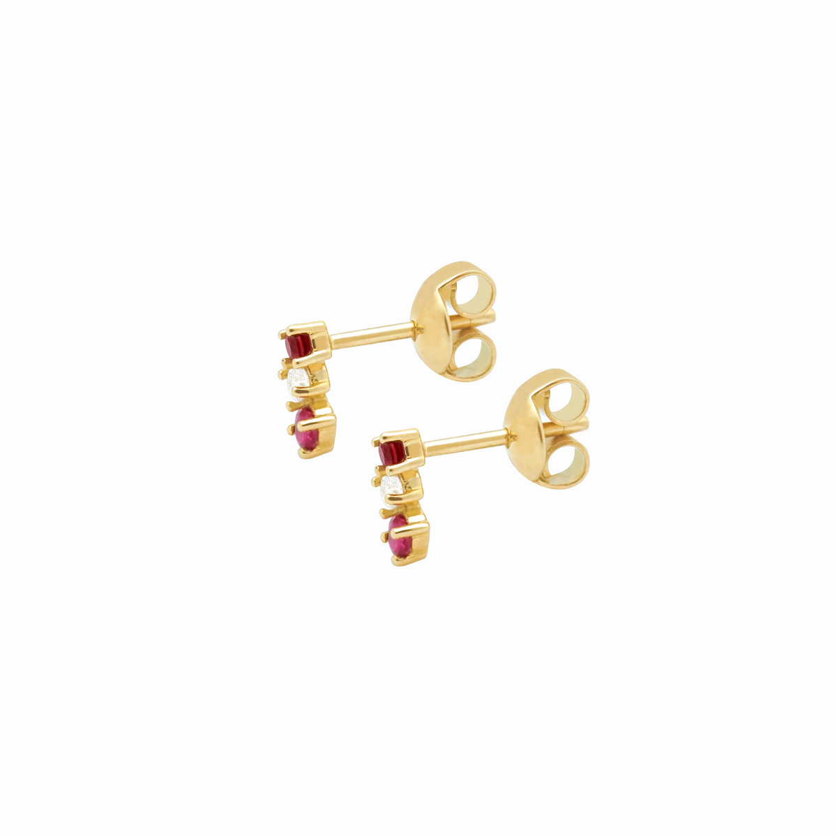 Aretes en oro amarillo 18K en curva con rubís y brillantes