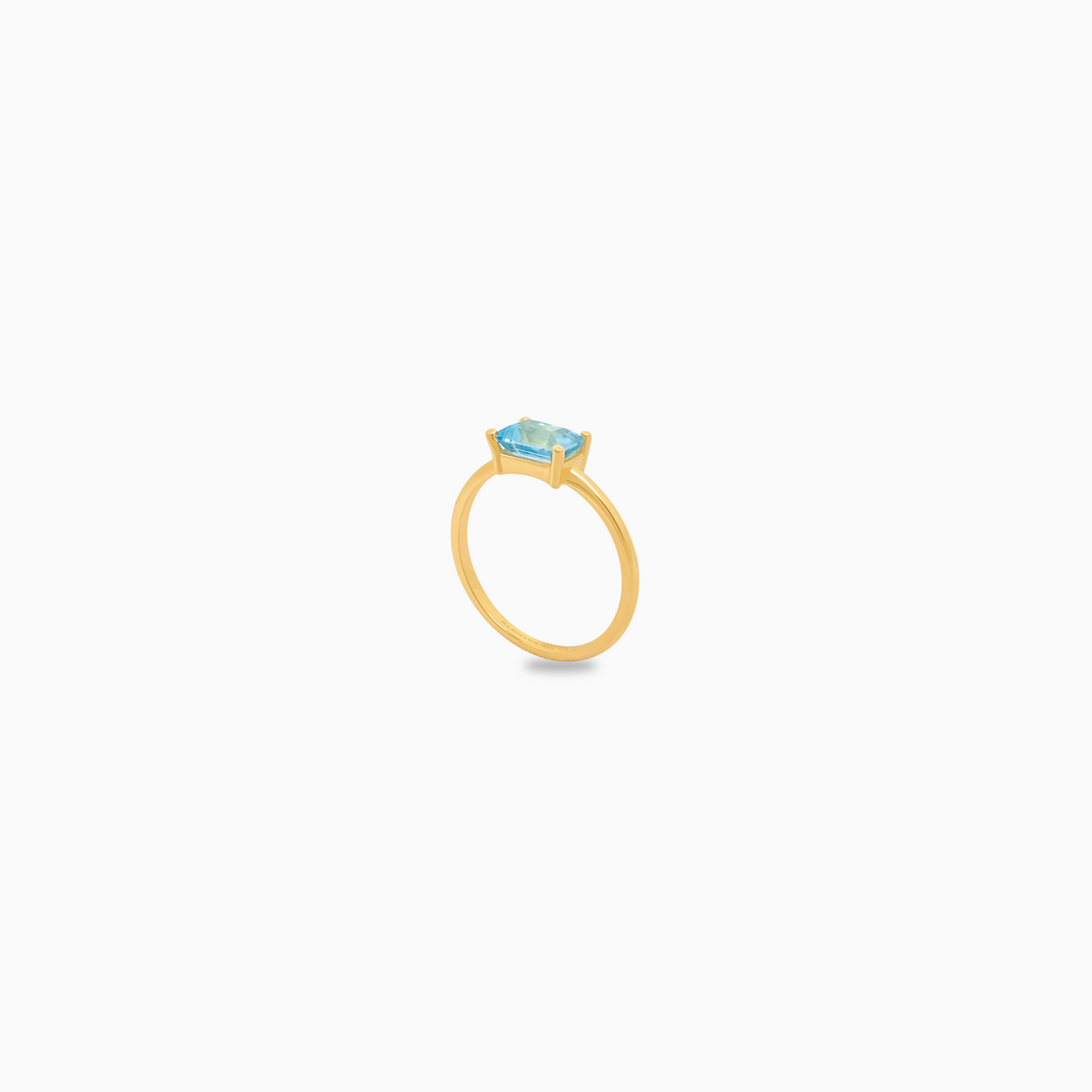 Anillo oro amarillo 18K topacio azul corte esmeralda