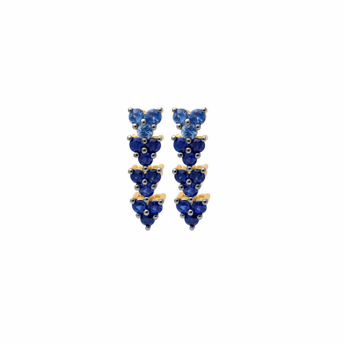 Aretes en oro amarillo de 18K con zafiros azules y rodio negro en uñas