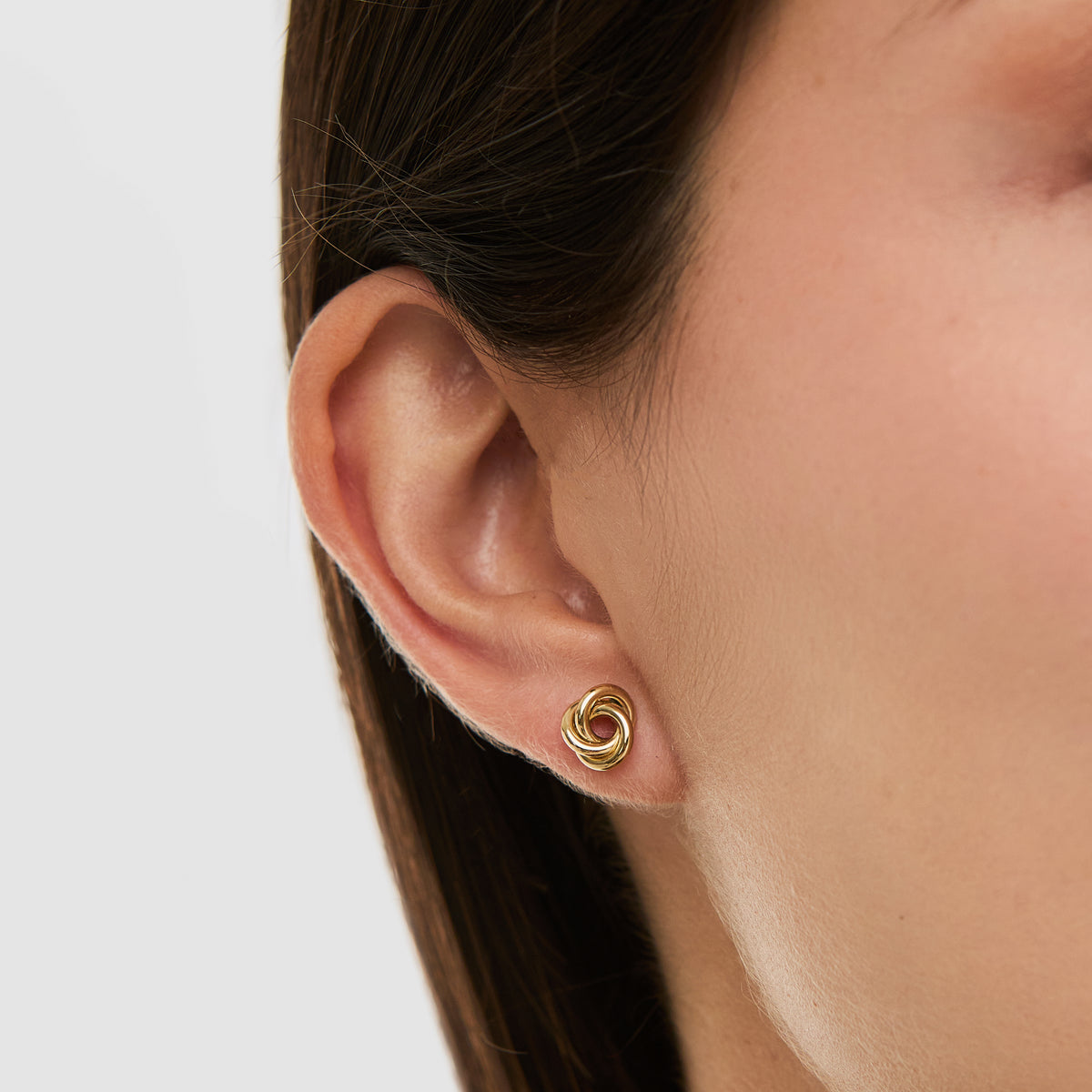 Arete oro amarillo 18K entrelazado nudo