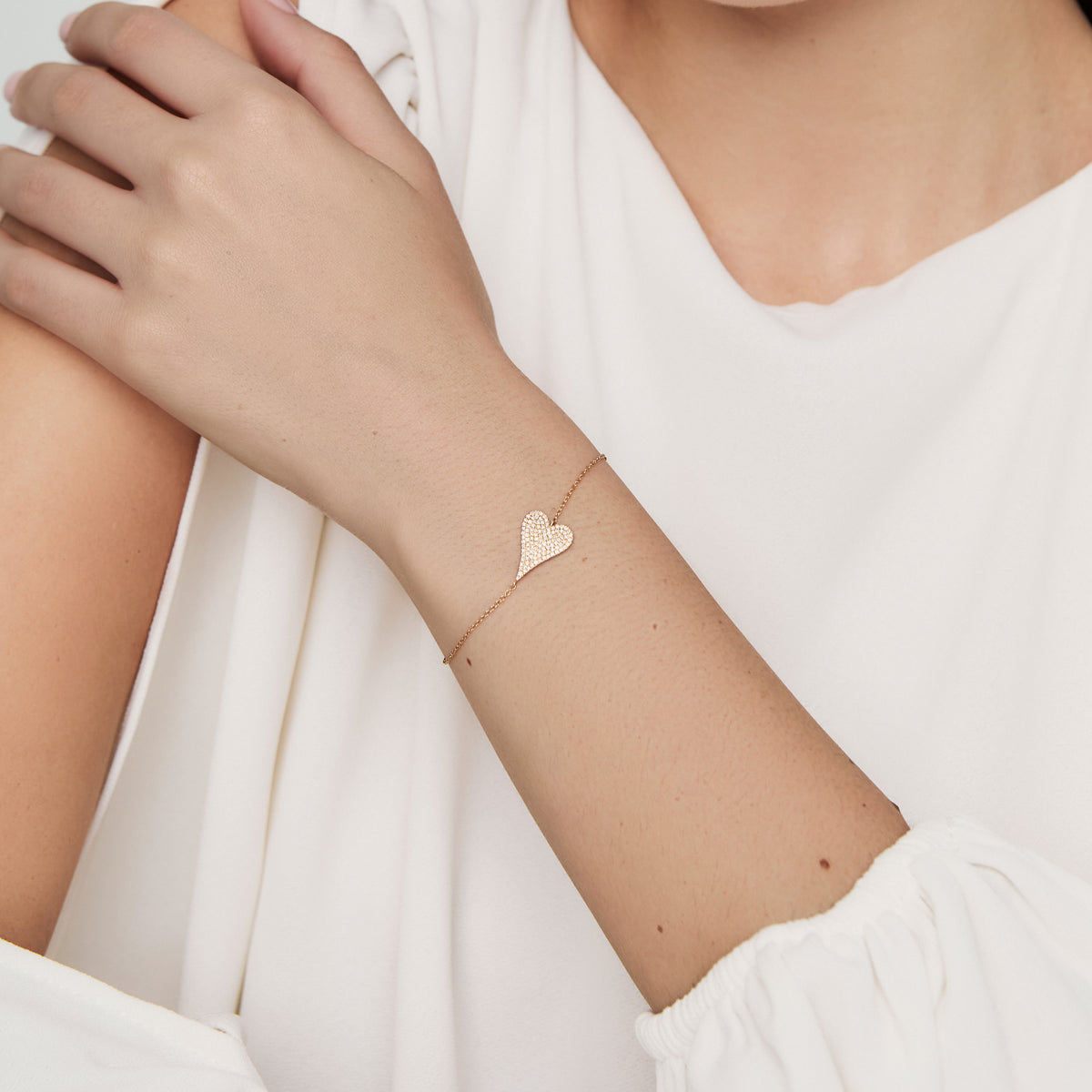 Pulsera oro amarillo 18K con placa corazon con brillantes
