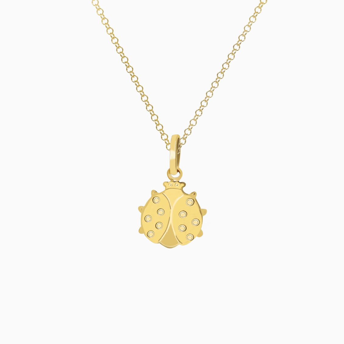 Dije en oro amarillo de 18K mariquita