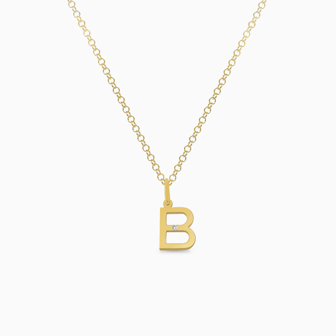 Dije en oro amarillo de 18K letra B moderna con brillante