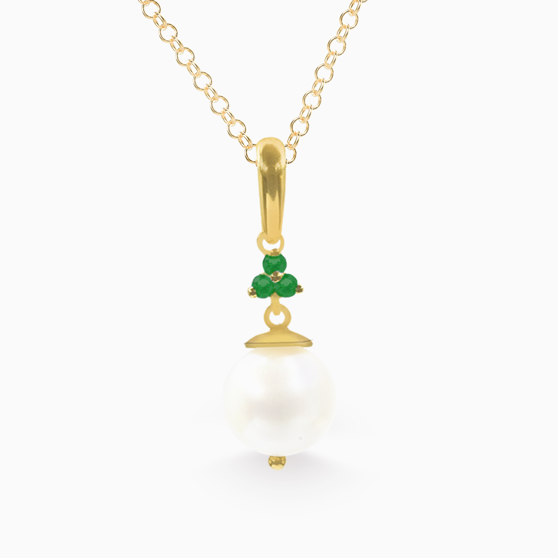 Dije en oro amarillo de 18K con perla y esmeraldas