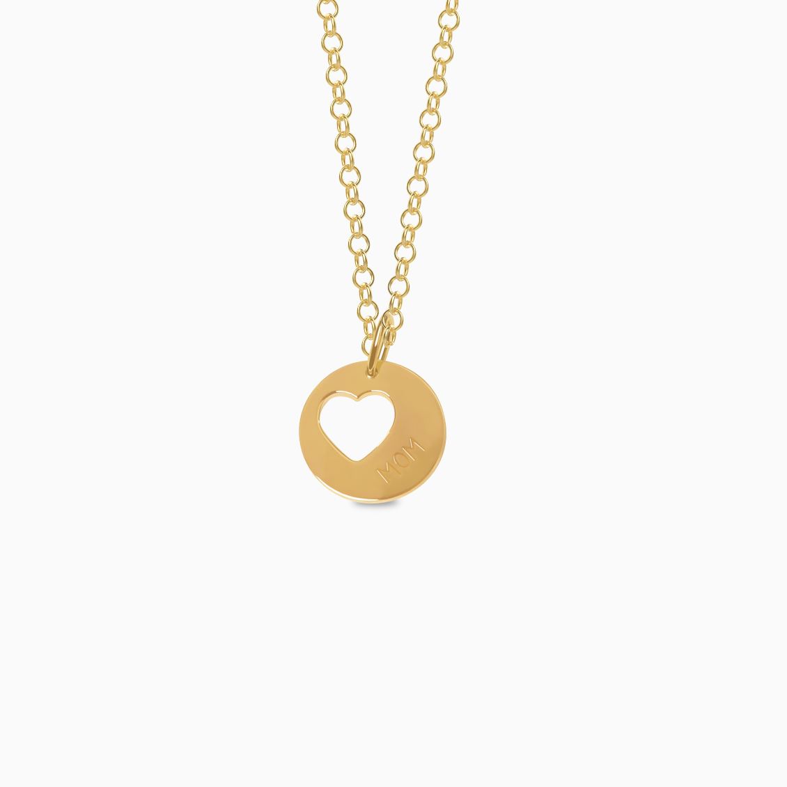 Dije en oro amarillo de 18K placa circular con corazón